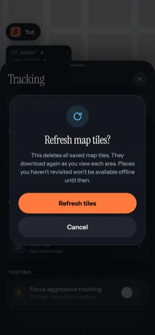 A Refresh map tiles dialog explaining that saved tiles will be deleted and downloaded again